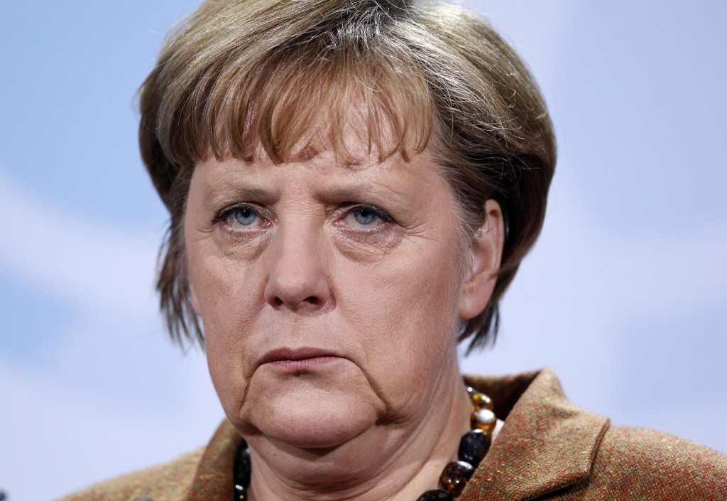 German Chancellor Angela Merkel attends a joint news conference with Palestinian Authority President Mahmoud Abbas, not seen. during their meeting at the Chancellery in Berlin, Germany, Thursday, Jan. 19, 2012. (AP Photo/Michael Sohn)